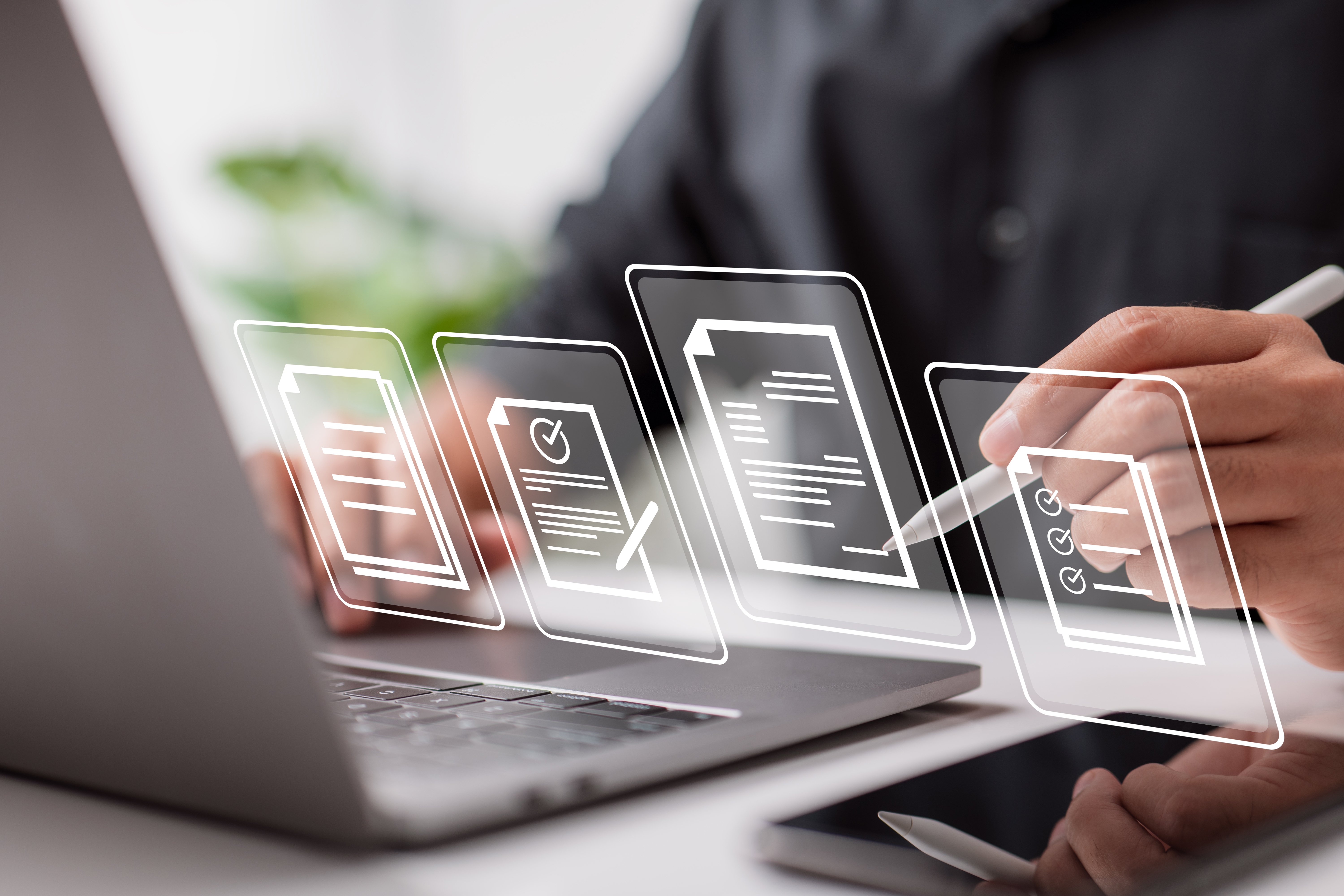 Man uses AI software to manage multiple procurement contracts.

